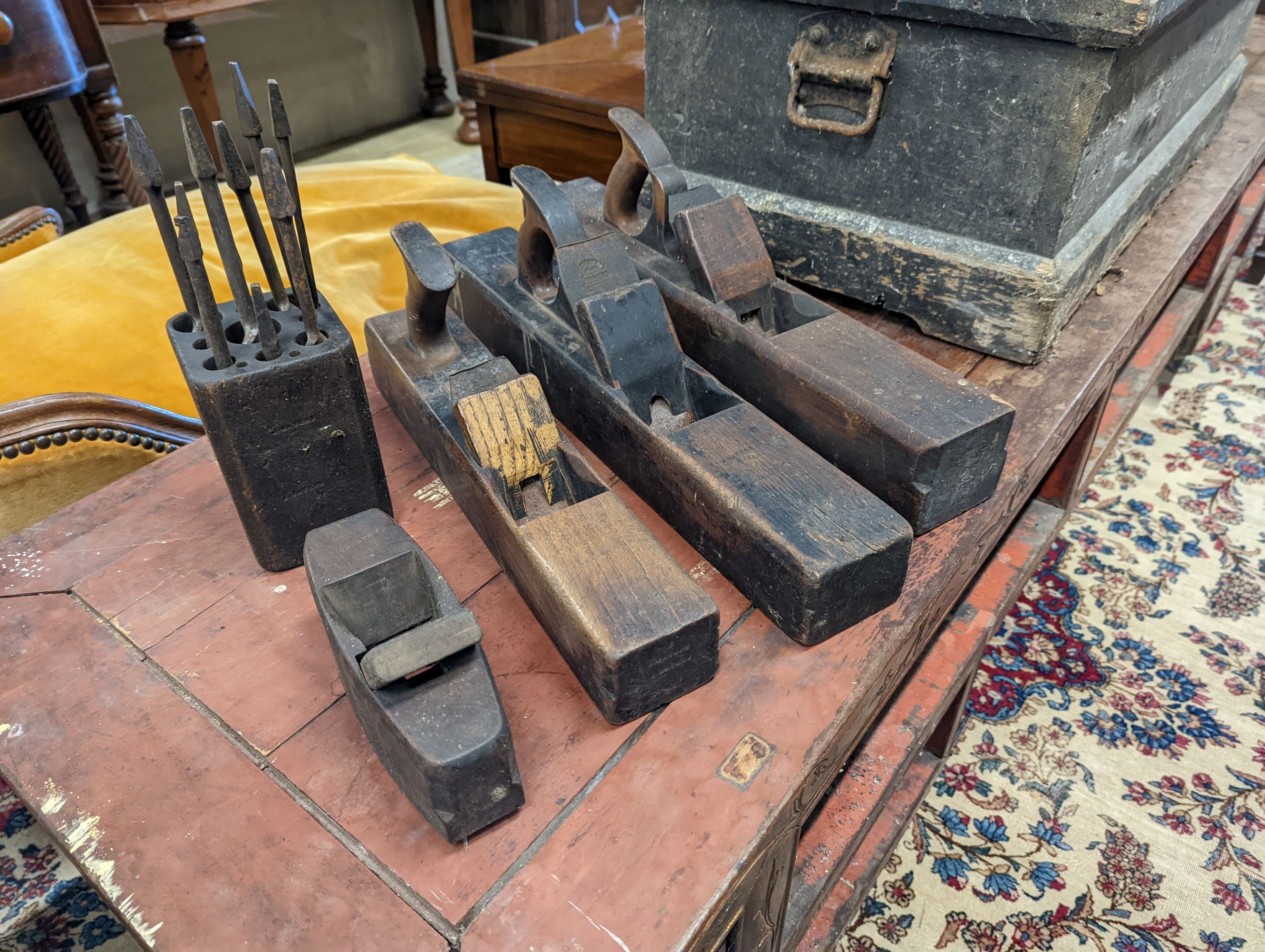 A Victorian pine carpenters chest and tools to include beech moulding planes, smoothing planes, chisels, bits, etc.